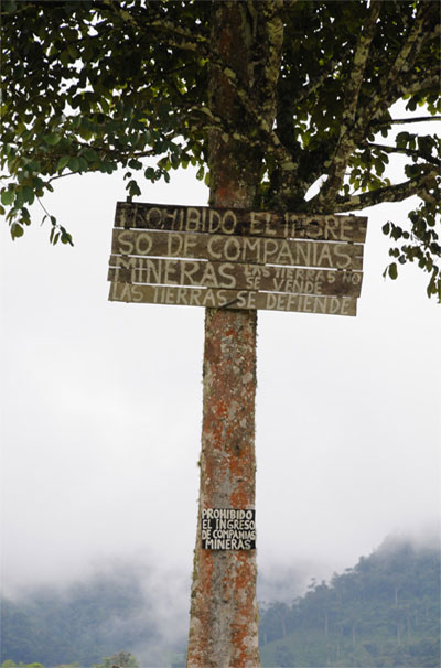 Mining Companies Prohibited sign on tree in Junín, Ecuador