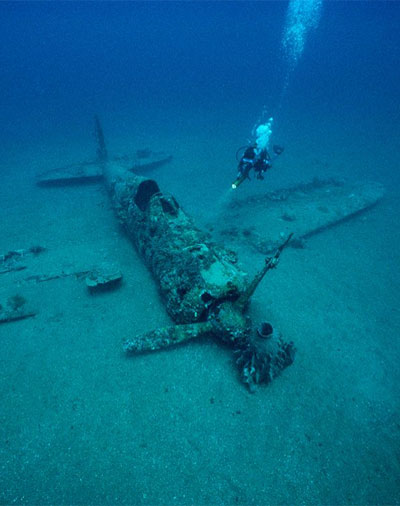 A diver explores the wreckage of a Japanese World War II fighter plane near the town of Rabaul in Papua New Guinea. Photo by David Doubilet, National Geographic